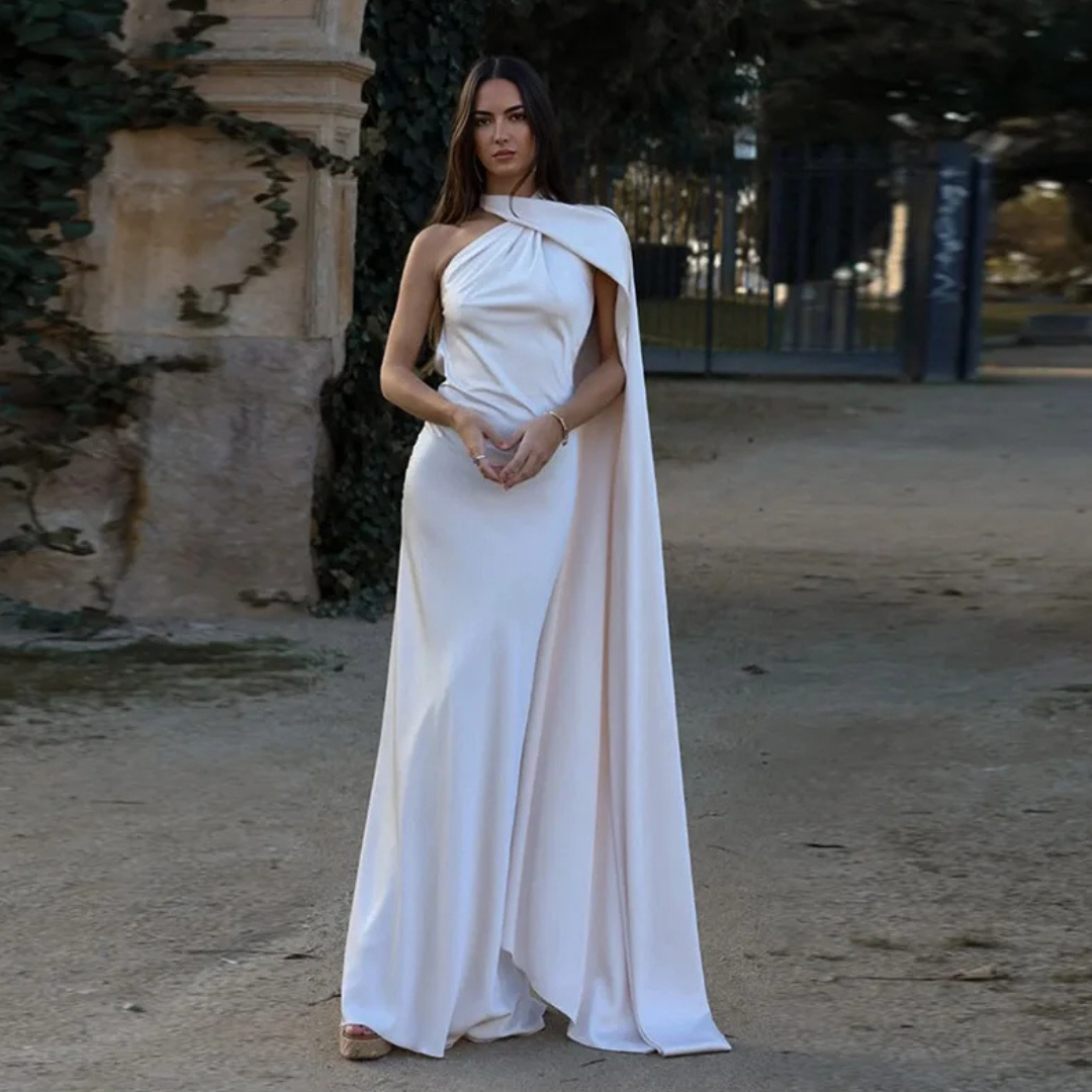 Vestido largo con espalda descubierta, cuello abotonado y pañuelo integrado.